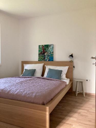 Postel nebo postele na pokoji v ubytování ELIXÍR Apartman Pécsvárad