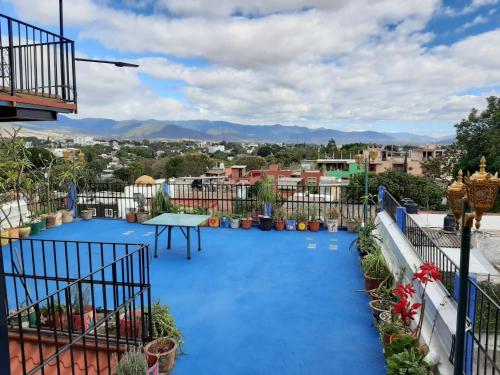 a view from the balcony of a house with a blue pool at Casa Xochimilco in Oaxaca City