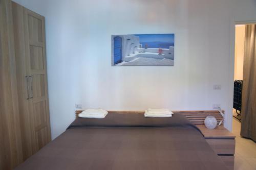 サンタ・マルゲリータ・リグレにあるSunrise Apartmentの部屋にベッドがある寝室