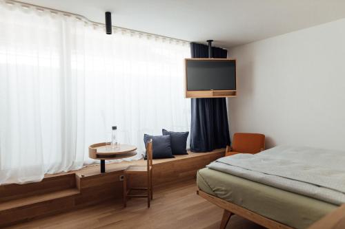 Postel nebo postele na pokoji v ubytování Haus am Turm
