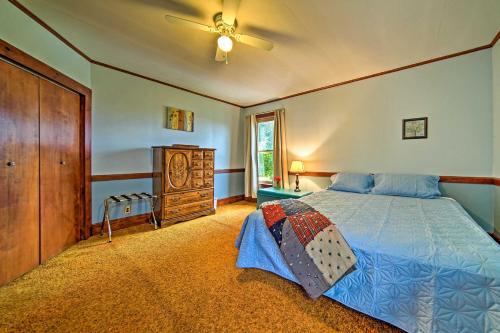 um quarto com uma cama, uma cómoda e uma janela em Historic Victorian Farmhouse with Porch and Views! em Mayville