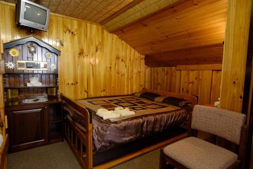 Ένα ή περισσότερα κρεβάτια σε δωμάτιο στο Karelia Alpine Lodge