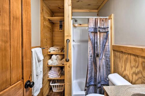 a bathroom with a shower and a toilet in a room at Silver Creek Cabin with Hiking, Less Than 1 Mi to Town! in Beattyville