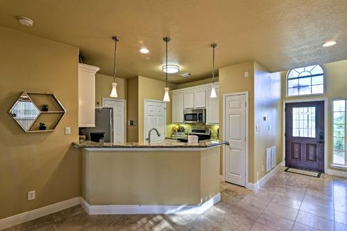 a kitchen with white cabinets and a counter top at Walk to Ocean Lakefront Dickinson Stucco House! in Dickinson