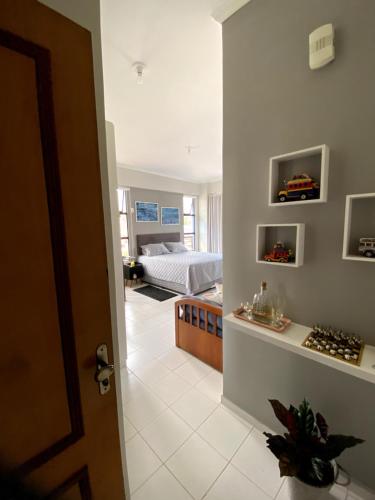 Katil atau katil-katil dalam bilik di Apartamento Studio - Novíssimo e Aconchegante em Caxambu MG