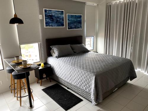 Katil atau katil-katil dalam bilik di Apartamento Studio - Novíssimo e Aconchegante em Caxambu MG