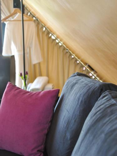a couple of pillows sitting on top of a couch at 3 Hills Boutique - The Ranch Experience in Trílofos
