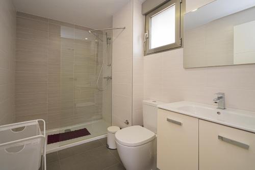a bathroom with a toilet and a sink and a shower at Vistabella in Orihuela Costa