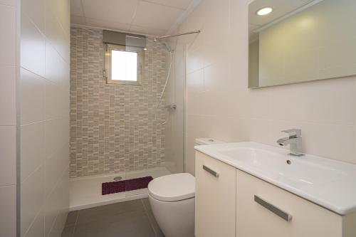 a bathroom with a toilet and a sink and a shower at Vistabella in Orihuela Costa