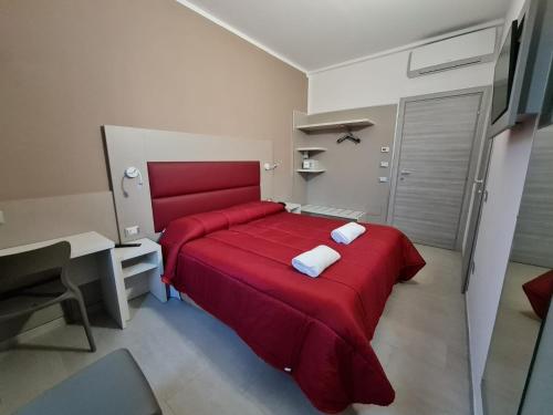A bed or beds in a room at Hotel City 20