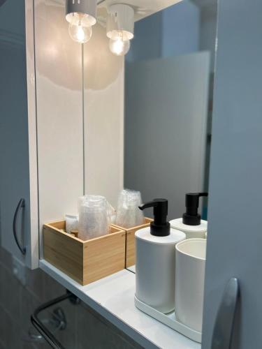 a bathroom with two sinks and a mirror at IL CAPRICCIO DI SILVIA in Sirmione