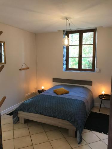 Кровать или кровати в номере Le moulin du Soudet