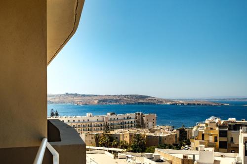 a view of the ocean from a building at Mayflower Hotel Malta in St Paul's Bay