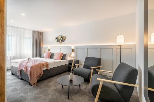 Postel nebo postele na pokoji v ubytování Hotel Bad Minden