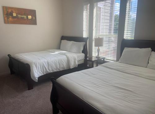 Ένα ή περισσότερα κρεβάτια σε δωμάτιο στο Spacious Apartments in The Woodlands, TX