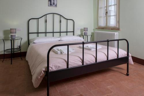 Cama o camas de una habitación en In Collegiata