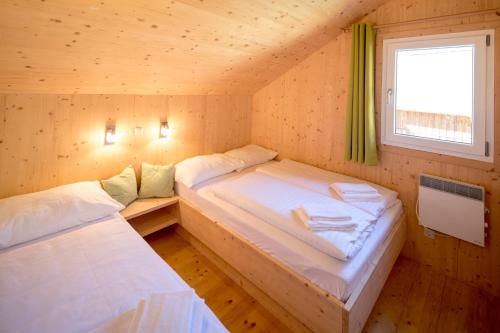 เตียงในห้องที่ Chalet Steiermark