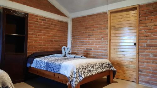 Postel nebo postele na pokoji v ubytování CABAÑAS TLAXCO LA LOMA