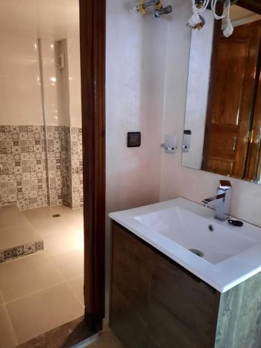 a bathroom with a sink and a shower at DARY in Fez