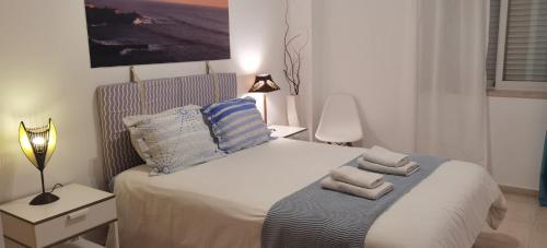 Ένα ή περισσότερα κρεβάτια σε δωμάτιο στο Apartment Ericeira