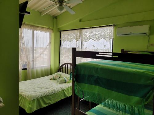 Postel nebo postele na pokoji v ubytování Hostal Haziel