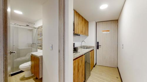 a small bathroom with a sink and a toilet at Terrazas in Bogotá