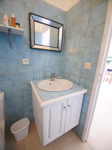 a bathroom with a sink and a mirror at 2 Bedroom Apt with Breathtaking view in Oyster Pond