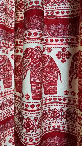 a red and white curtain with elephants on it at Nomada Hostel in Asuncion