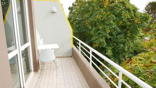 a balcony with a white chair and a white desk at TALEN OTEL in Istanbul