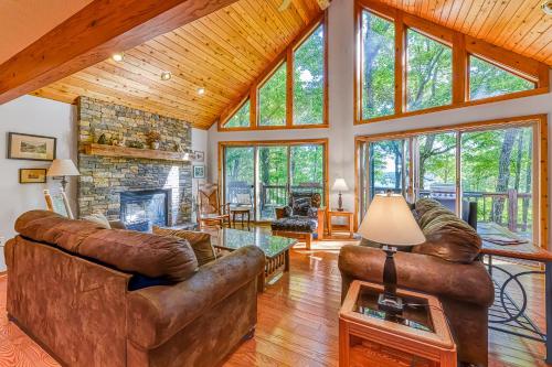 a living room with leather furniture and a fireplace at Mirabella Eclano in McHenry