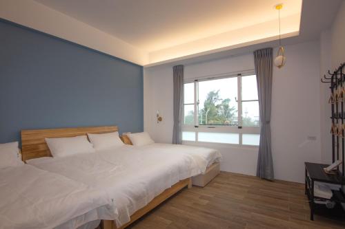 Postel nebo postele na pokoji v ubytování Auspice Garden Homestay