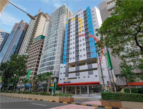 a group of tall buildings in a city at Hop Inn Ortigas Center Manila in Manila