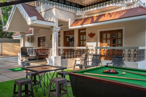 a pool table in front of a house at Villa Calangute Phase 2 in Calangute