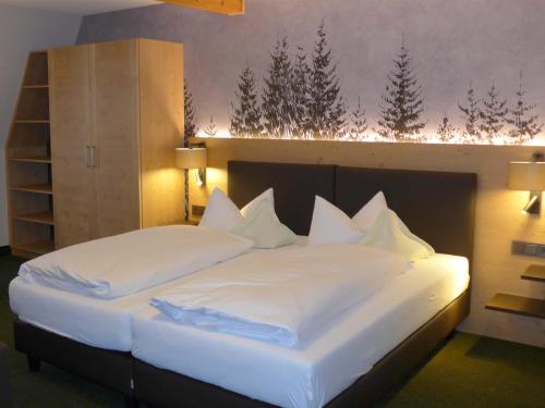 Cama o camas de una habitación en Gästehaus Kaiser
