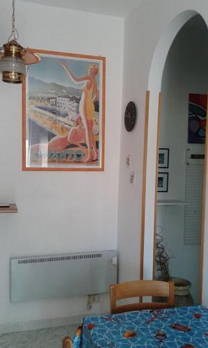 a bedroom with a picture of a woman on the wall at La Terrazza sul Mare in Levanto