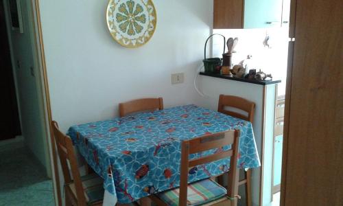 a table and chairs with a blue table cloth on it at La Terrazza sul Mare in Levanto