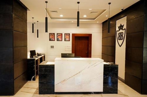 an office with a desk with a laptop on it at Baity Boutique Hotel in Aqaba