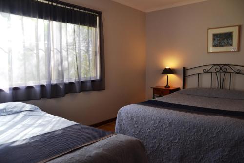 Ένα ή περισσότερα κρεβάτια σε δωμάτιο στο Avoca Cottages VICTORIA