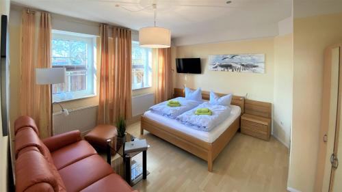 Ένα ή περισσότερα κρεβάτια σε δωμάτιο στο Ferienhaus An der Steilkuste