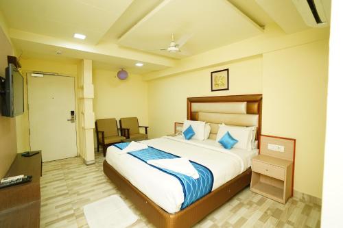 מיטה או מיטות בחדר ב-Hotel SK Riverfront