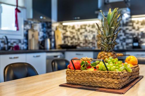 a basket of fruit sitting on top of a table at Villa Aelia by Kardous in Alikias