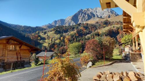 a view of a mountain from a house at Chalet La Canopée in La Giettaz