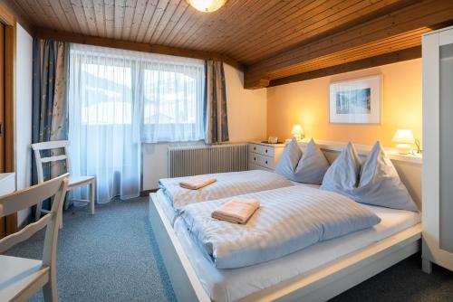 Posteľ alebo postele v izbe v ubytovaní Naturpension Mühlhof