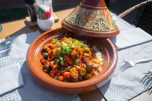 a bowl of food sitting on top of a table at Whispering Pines Country Estate in Magaliesburg