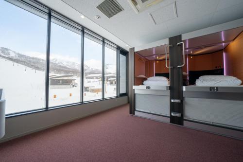 Ένα ή περισσότερα κρεβάτια σε δωμάτιο στο The Lodge Moiwa 834