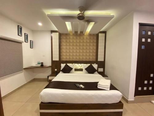 a bedroom with a large bed in a room at THE PORCH INN in Wayanad