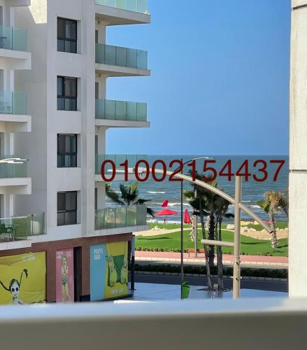 a view of a building with a sign on it at شقة غرفتين وصاله- بورتوسعيد Porto Said Resort in Port Said