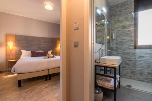 Postel nebo postele na pokoji v ubytování Hôtel Bahia