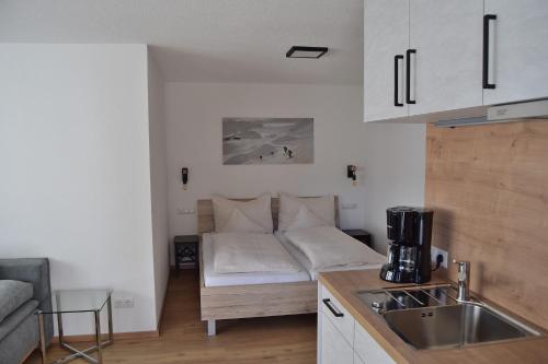 Kuchyň nebo kuchyňský kout v ubytování Appartement FloPi