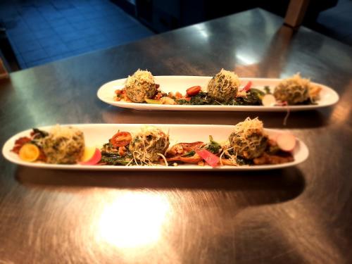 two plates of food sitting on a table at Landhotel Albrecht in Missen-Wilhams